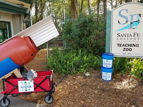 compost cart and 2 buckets in front of zoo entrance