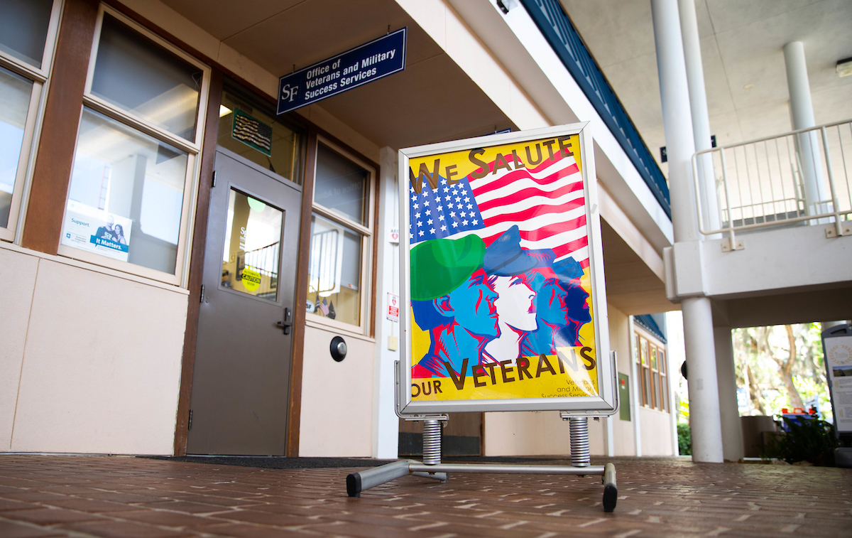 A sign outside the Santa Fe College Office of Veterans and Military Success Services reads, 