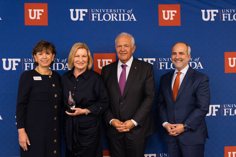 Sherry Houston standing with three other individuals during the Win Phillips Town Gown Relations Awards ceremony.