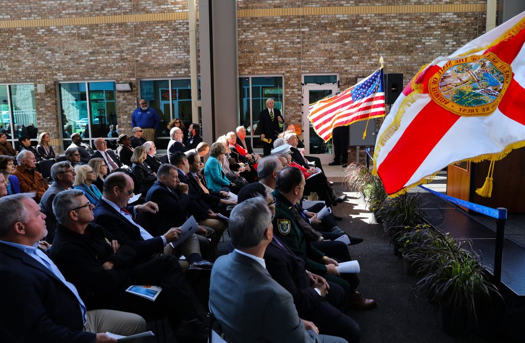 The crowd watches a simulation during dedication of the Institute of Public Safety at the Santa Fe College Kirkpatrick Center on Friday, March 23, 2018