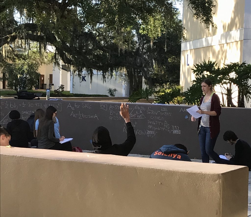 SF mathematics professor Lorisha Riley holds her 8 a.m. class outside during Wednesday morning's power outage on the Northwest Campus.