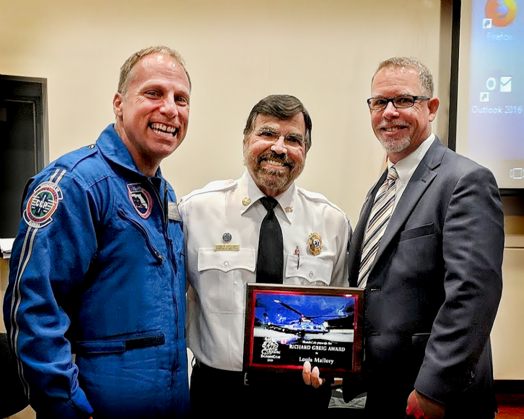 Louis Mallory (center), with ShandsCair Chief Flight Nurse, Todd Brooks (left), and ShandsCair Director Ed Crews.