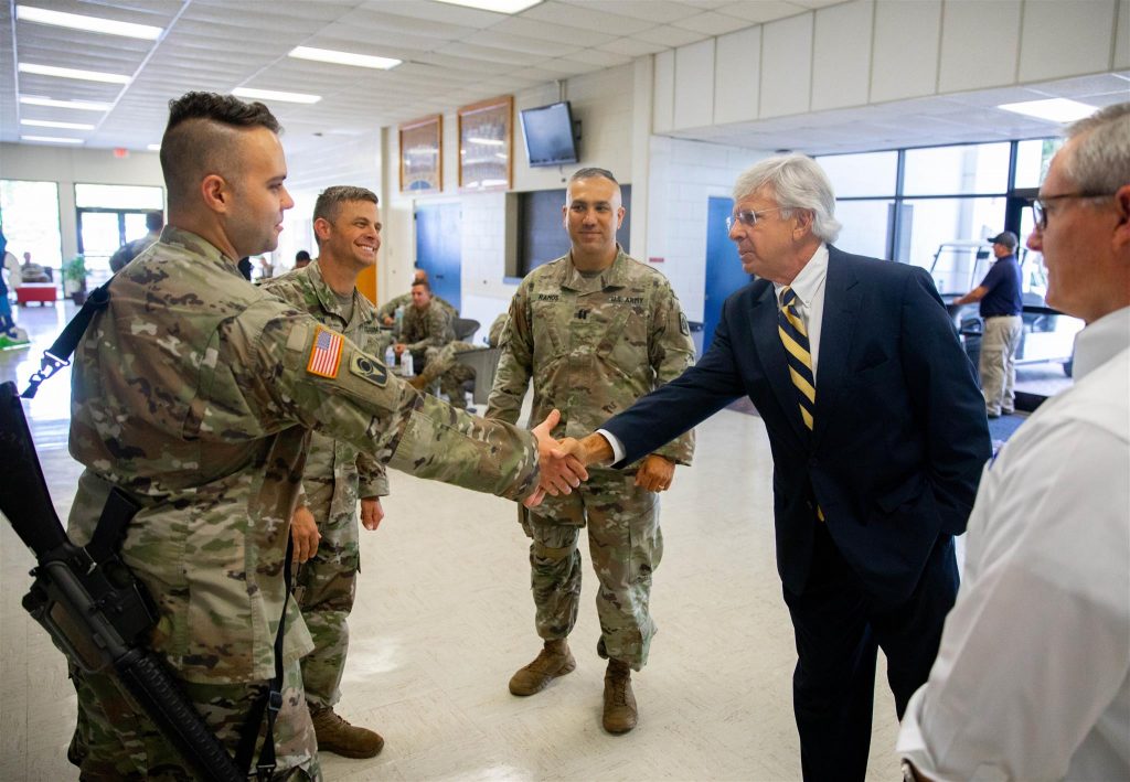 SF President Jackson Sasser greeting members of the U.S. National Guard.