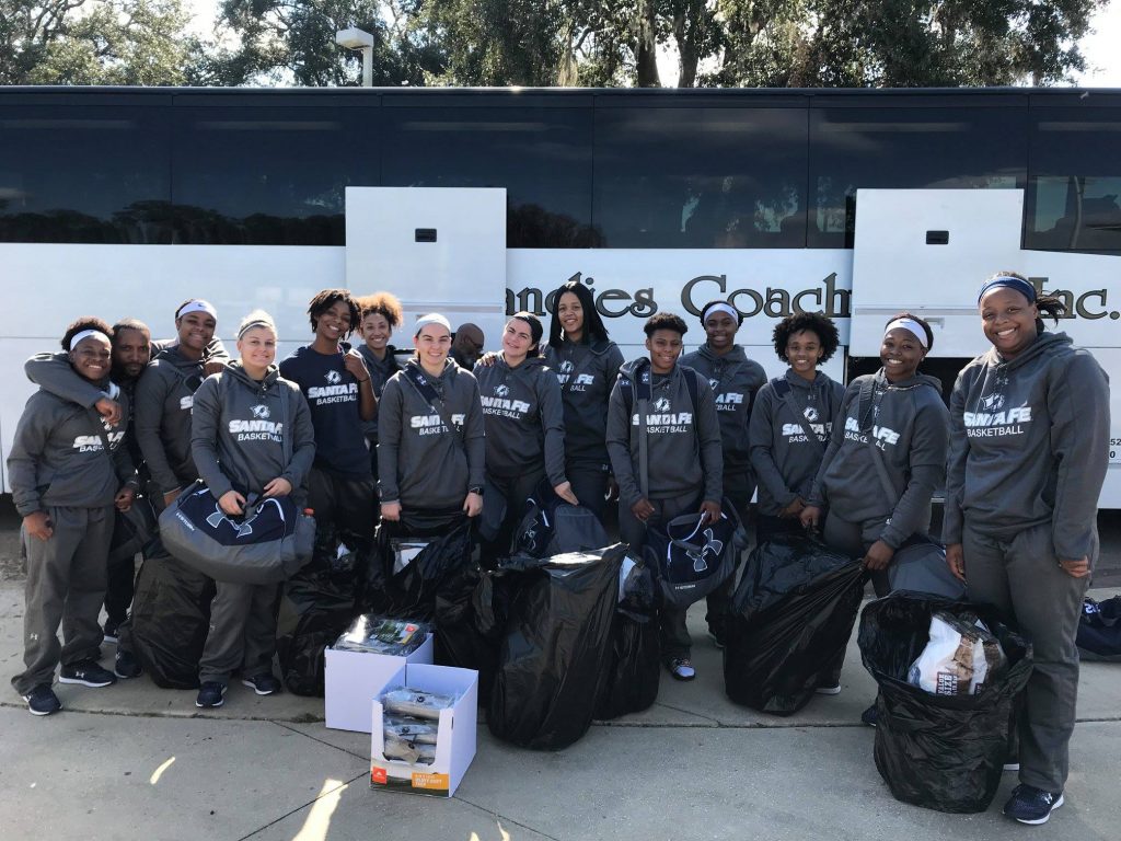 The Santa Fe Saints women's basketball team take supplies up to the area impacted by Hurricane Michael