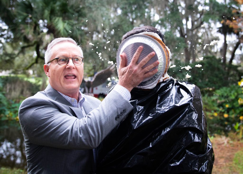 Santa Fe College Vice President for Advancement Chuck Clemons won the annual United Way Penny Wars giving him the honor of throwing a pie in the face of SF Student Body President Alejandro Puga.