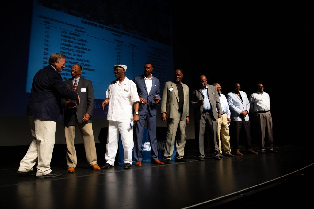 Athletics Director Jim Keites with the 1980-81 Men’s Basketball Team during the Santa Fe Saints Athletics Hall of Fame Enshrinement Ceremony April 13, 2019.