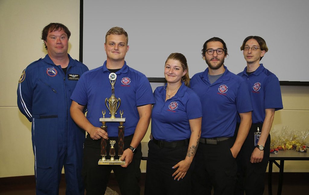 Paramedic instructor Greg Welch with students Kyle Boatright, Kacey Brooker, Kevin Hicks and Michael Anechiarico following SF's third-place finish in the statewide competition.