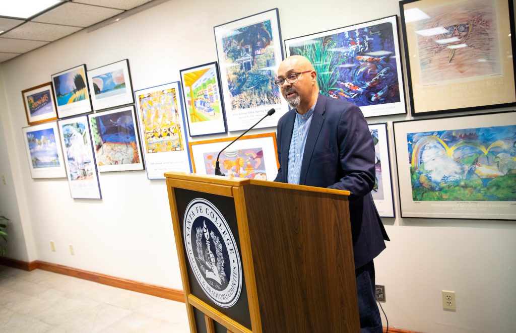 Raul Villarreal speaks during a reception to recognize Spring Arts Festival poster artists on Friday, Sept. 21, 2018 in Gainesville, Fla. 