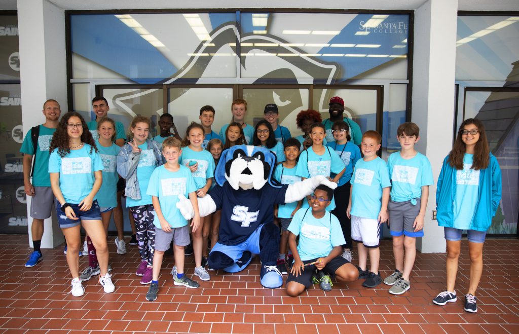 SF mascot Caesar with several College for Kids students.