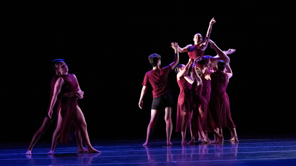 Several dancers performing on stage.