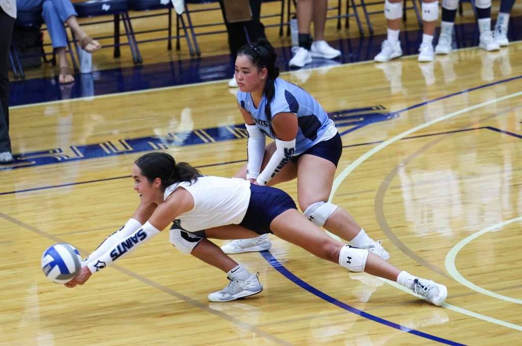 two volleyball players playing 