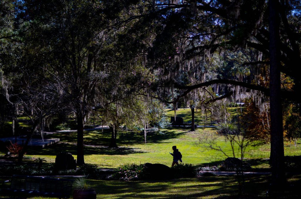 A person walking on Santa Fe College's Northwest Campus.