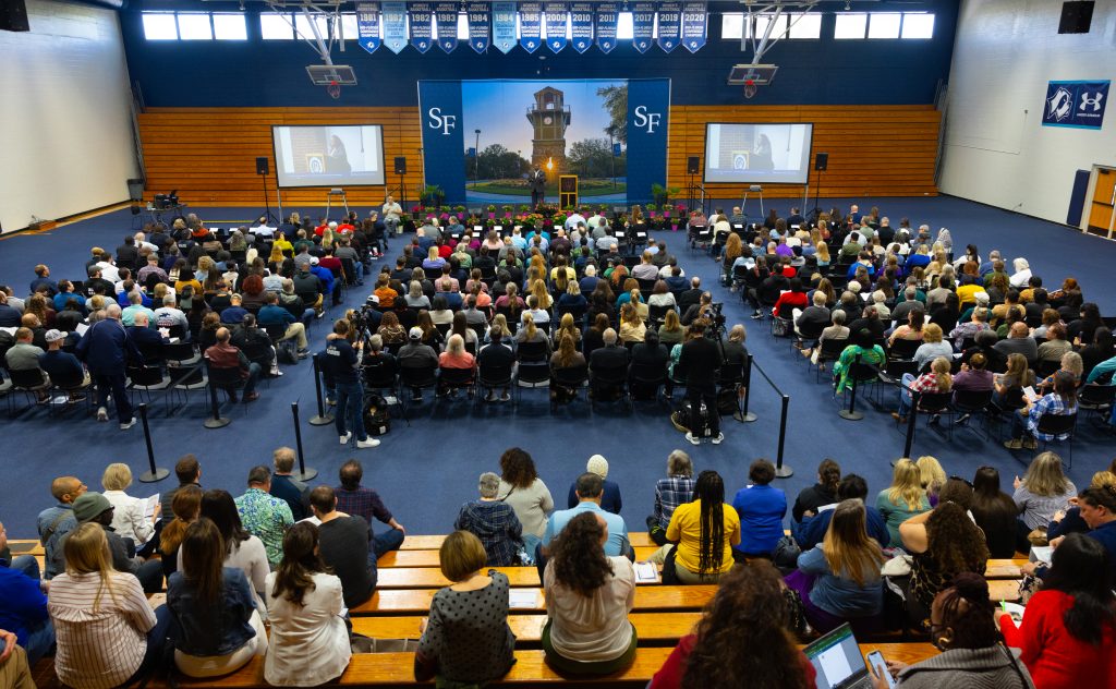 Santa Fe College President Paul Broadie II, Ph.D. on stage in the Santa Fe College Gym.