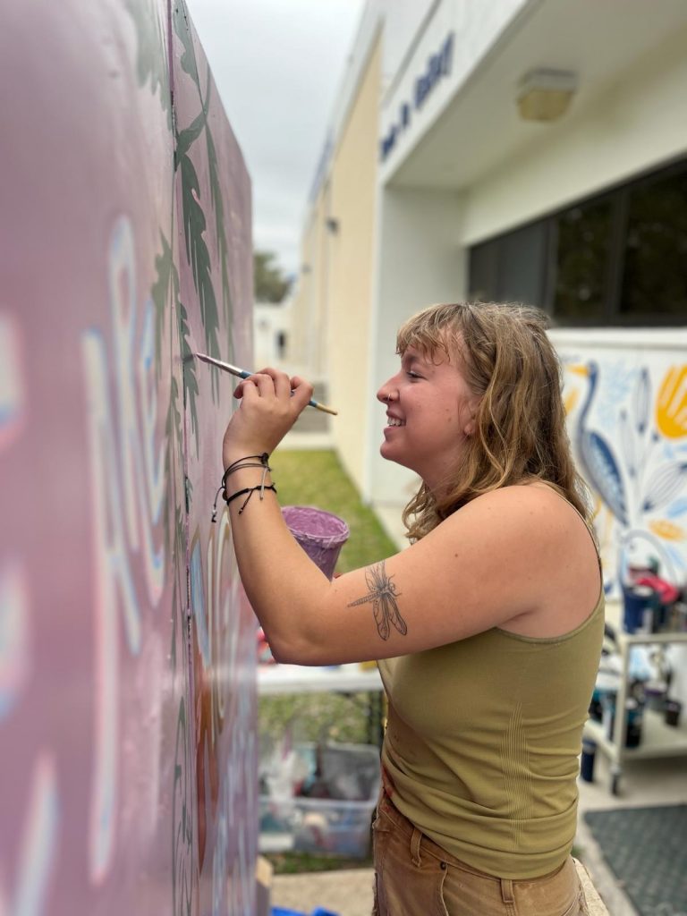 A person painting a wall.