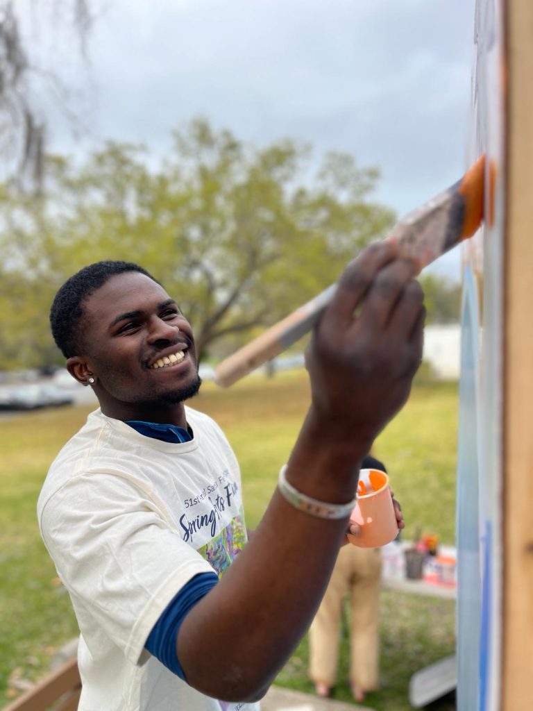 A person painting a wall.