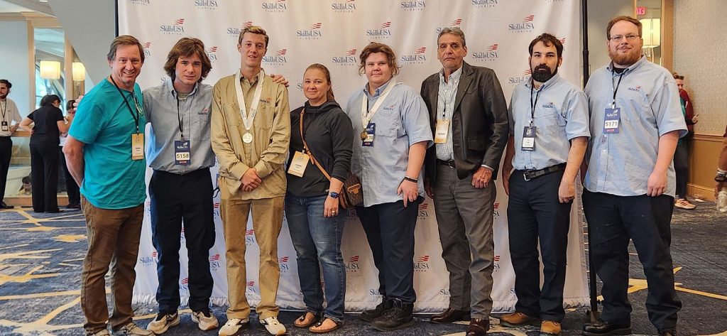 Santa Fe College Construction and Technical Programs students and instructors pose for a photo at the 2024 SkillsUSA Florida State Leadership and Skills Conference at the Prime F. Osborn III Convention Center in Jacksonville, Florida.