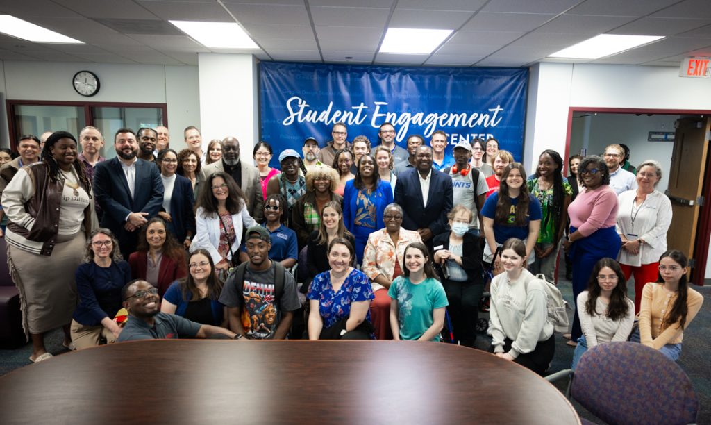 A group of people posing for a photo at the new Student Engagement Center on Santa Fe College's Northwest Campus.