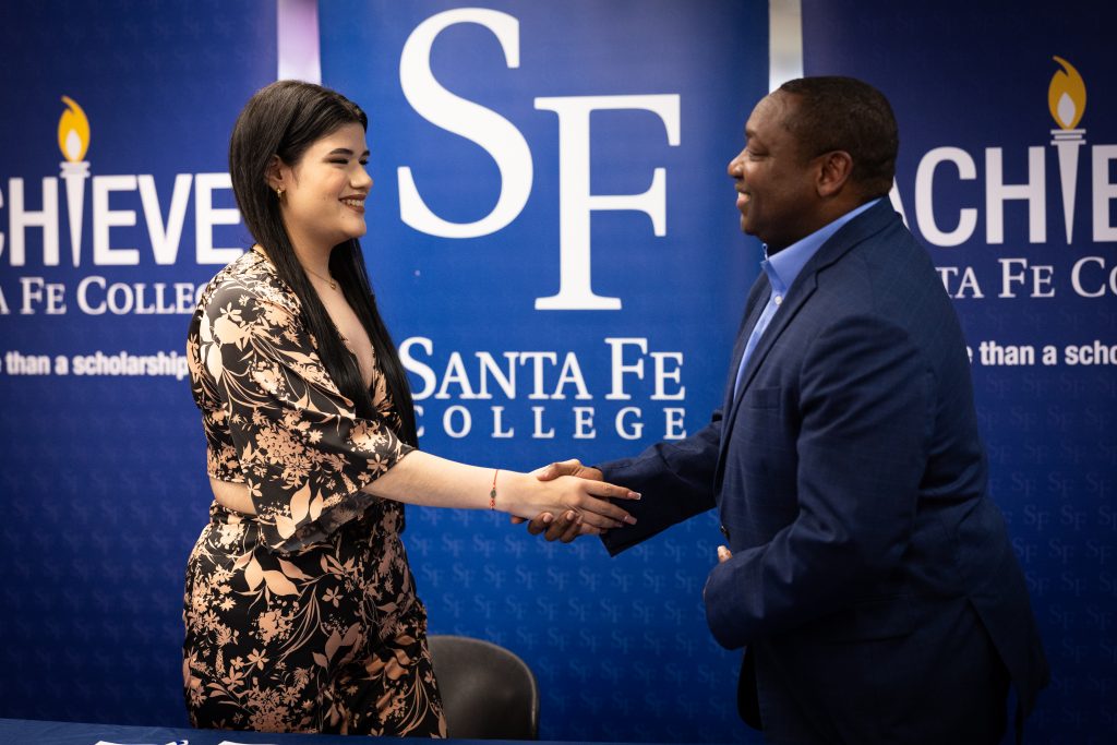 Two people shaking hands.