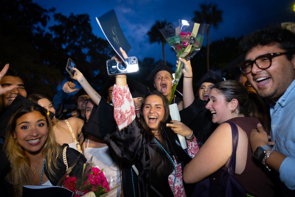 Santa Fe College graduates and their friends celebrating their accomplishments.